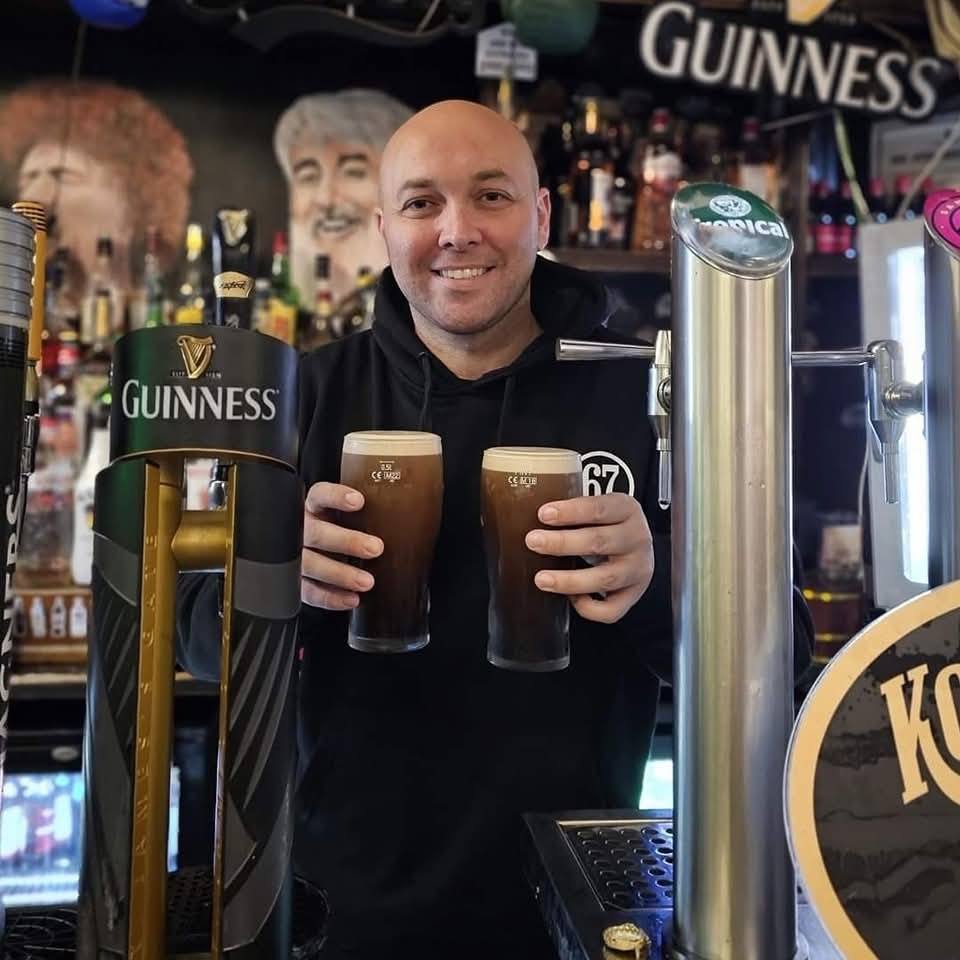 Dave pouring two pints of Guinness at Bar 67, Puerto del Carmen